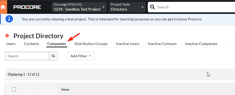 Procore Project Directory interface with the 'Companies' tab selected, highlighted by a red arrow.